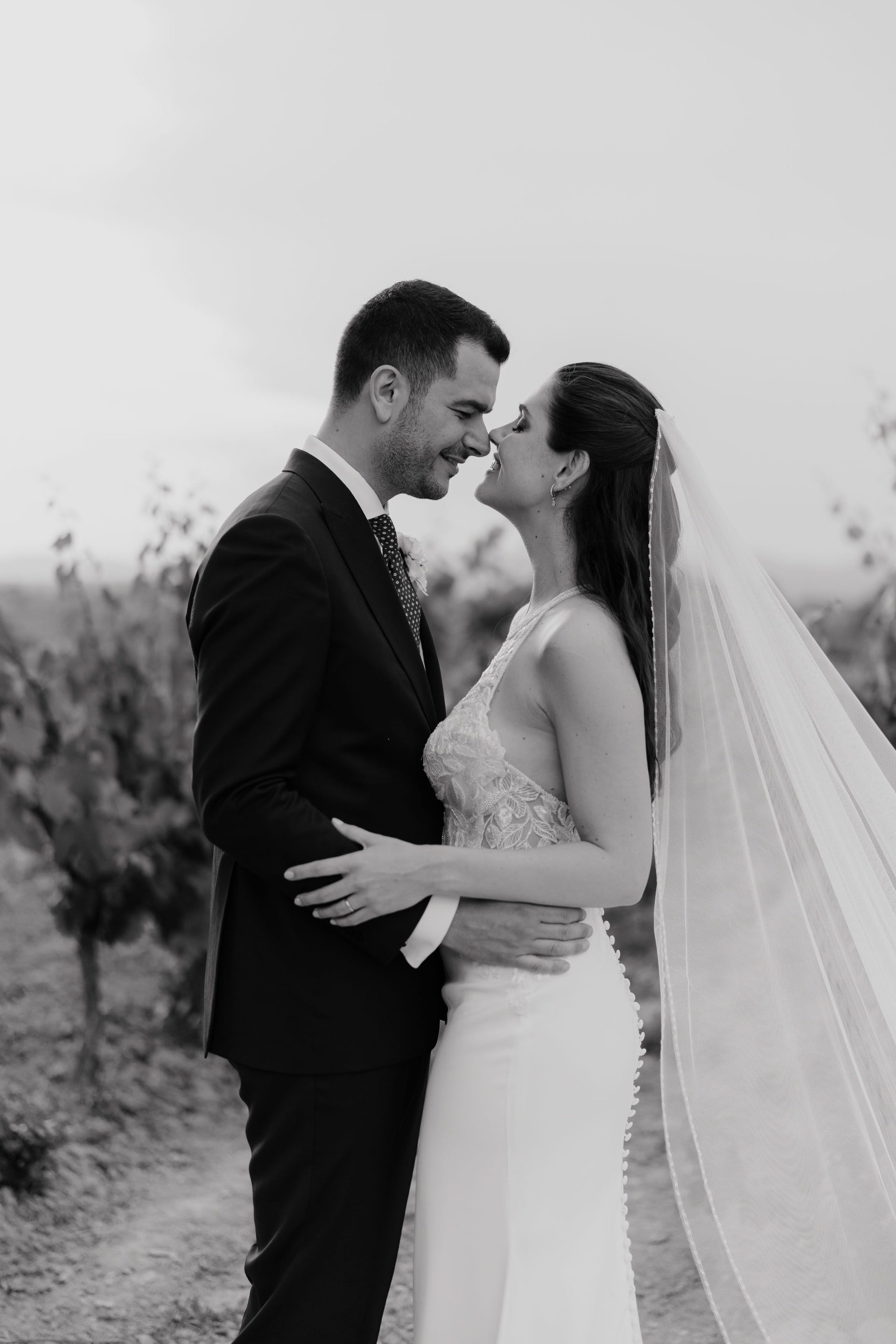 A black-and-white embrace beneath the veil.