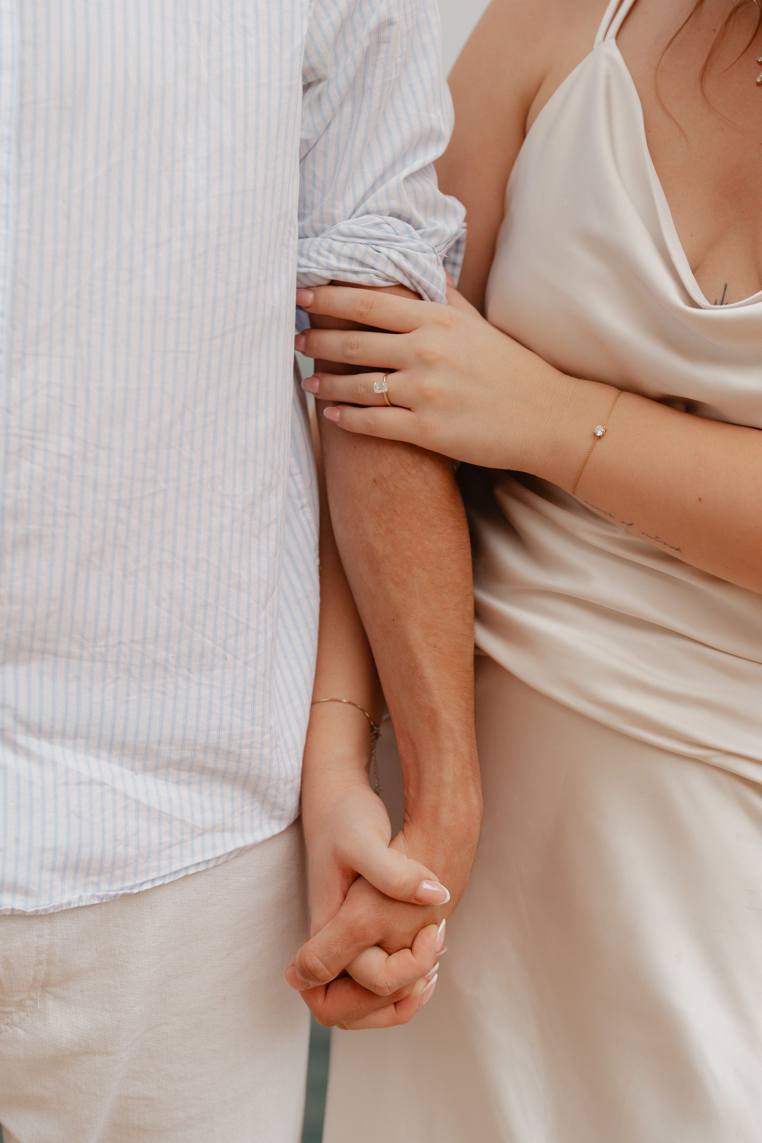 A close-up of hands held gently together.