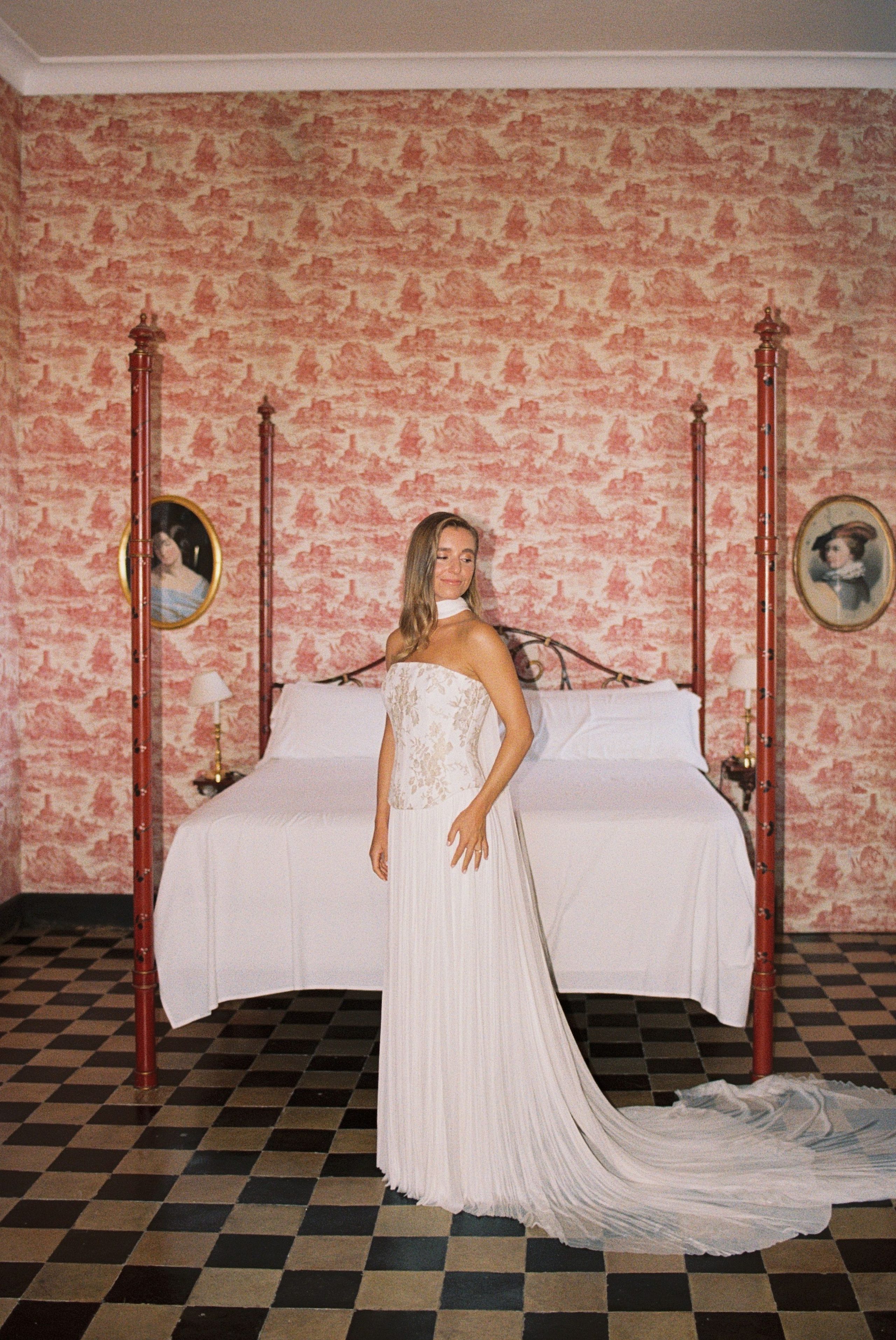 A bridal portrait in a room with patterned walls.