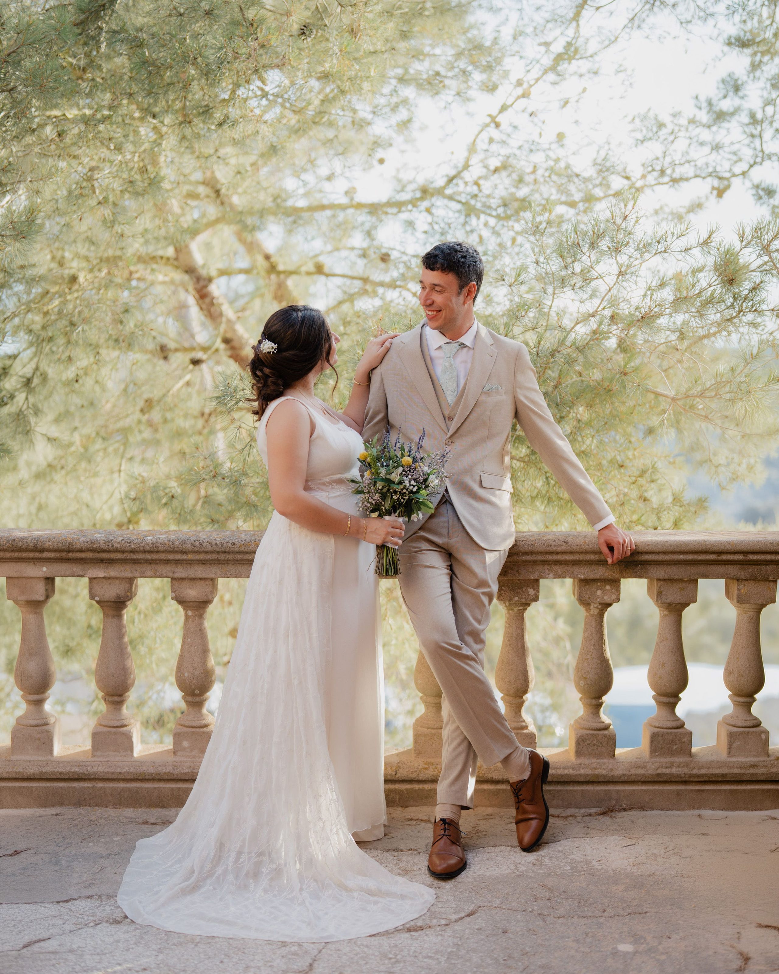 A couple's portrait on a stone terrace.