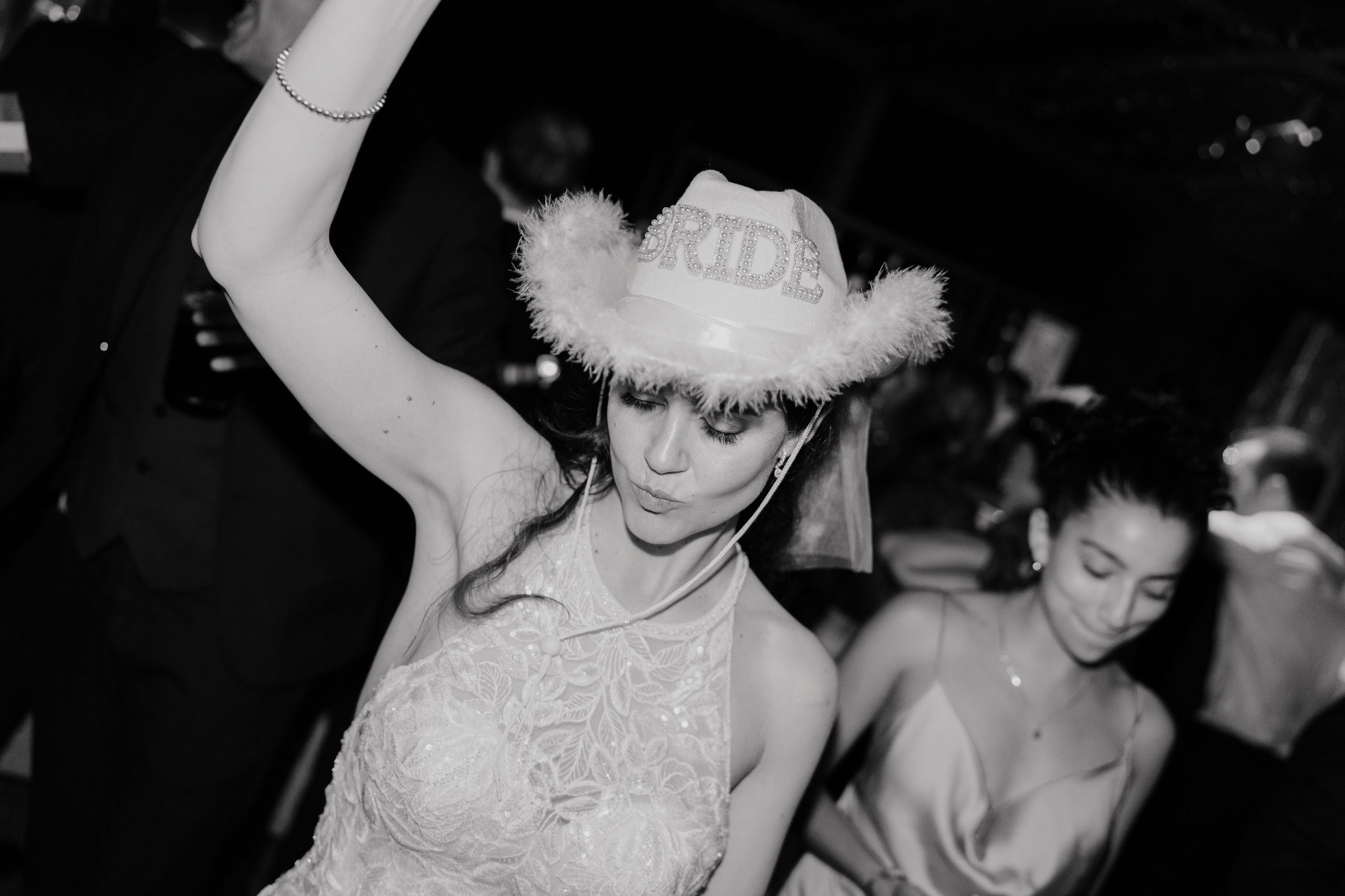 On the dance floor, a cowboy hat and a smile.
