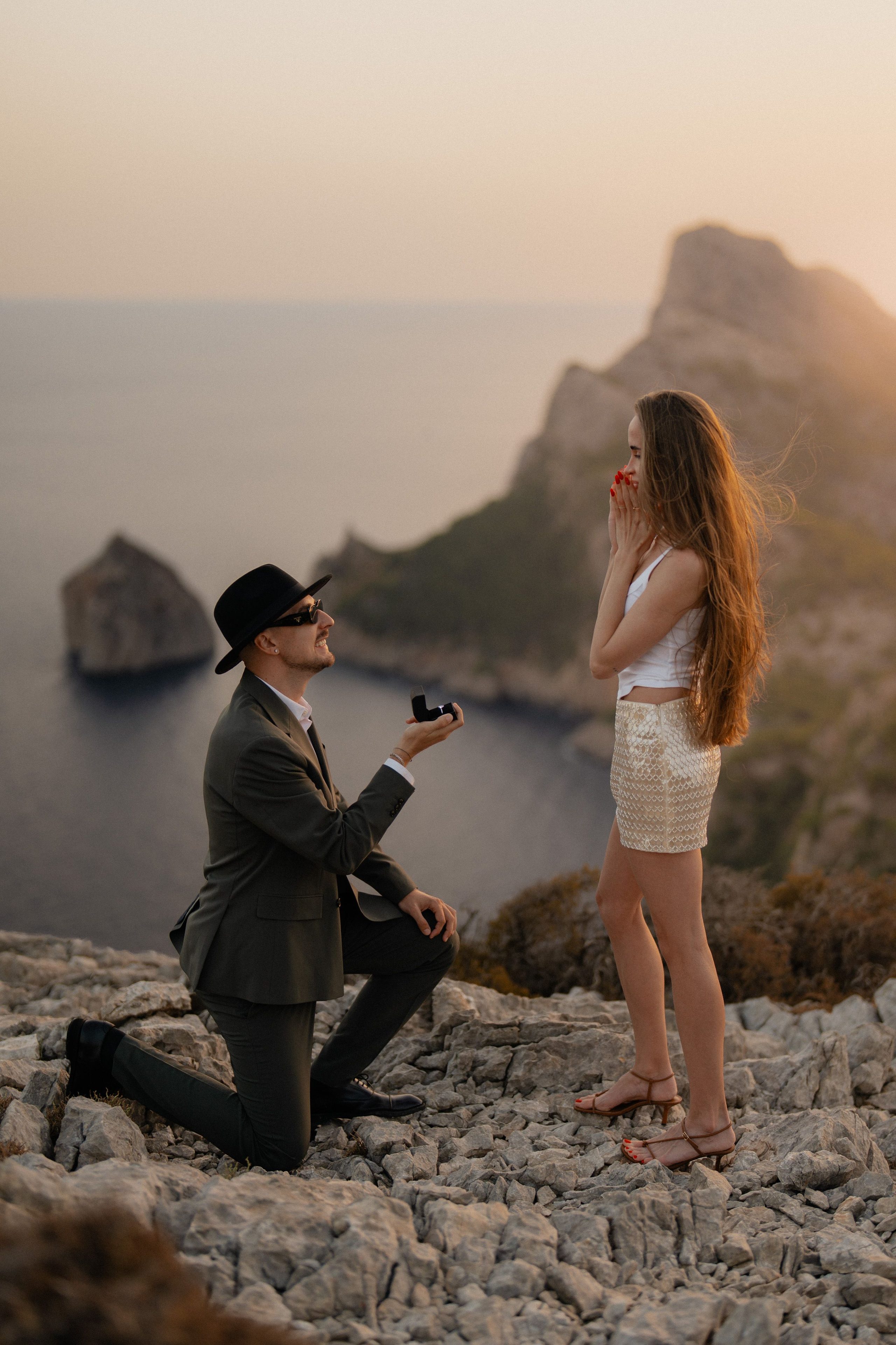 A proposal above the sea at sunset.